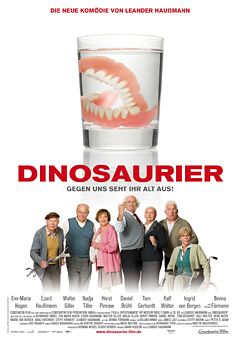 Filmplakat "Dinosaurier" zeigt ein Gebiss im Glas und die Darstellerriege